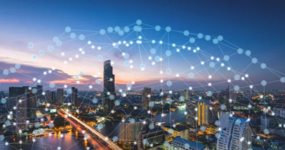 How does IoT architecture promote the construction of smart cities?