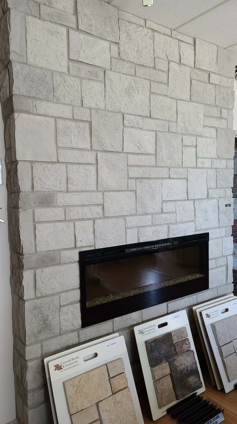 How to organize your living room with a stone fireplace?