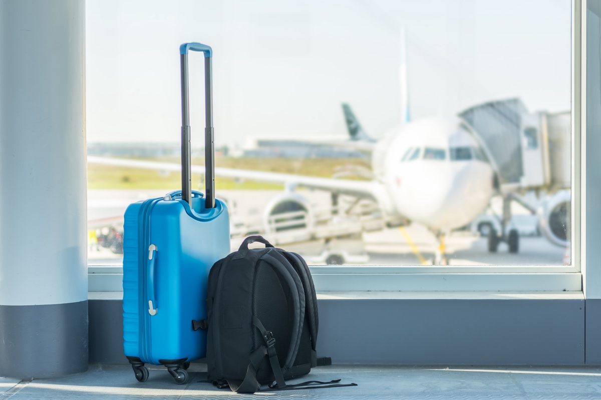 What is the cost for check bags on Frontier Airlines flights?