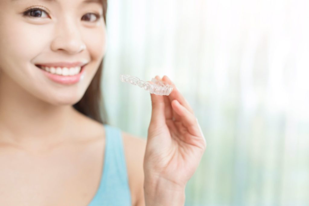 What benefits can you get with Invisalign that goes beyond cosmetics?