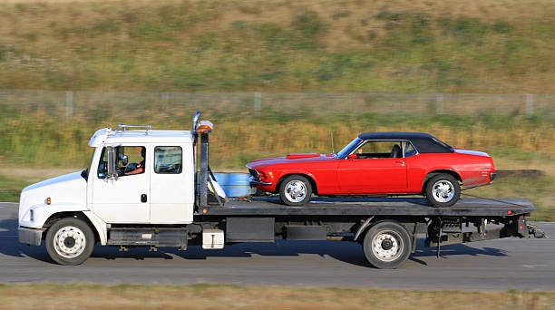 Navigating Roadside Challenges with Flatbed Towing