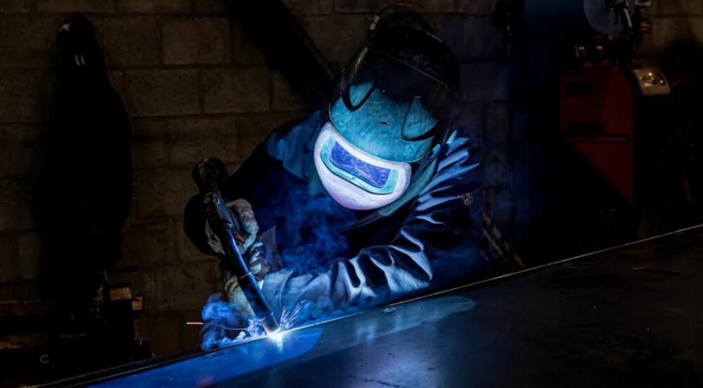 How do I ensure the authenticity and quality of a MIG welder when buying from an online website?
