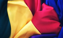 What kind of fabric is used to make outdoor flags strong and durable?