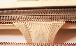 What is a warp knitting machine-like?