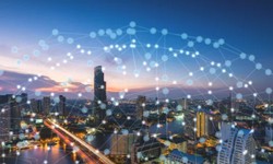 How does IoT architecture promote the construction of smart cities?