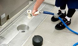 How do I clean my commercial drains?