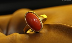 What are the benefits and negative consequences associated with wearing the Red Coral gemstone?