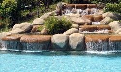 Integrating Natural Elements: Rock and Waterfall Features by The Woodlands Pool Builders