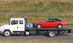 Navigating Roadside Challenges with Flatbed Towing