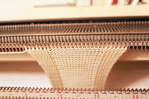 What is a warp knitting machine-like?