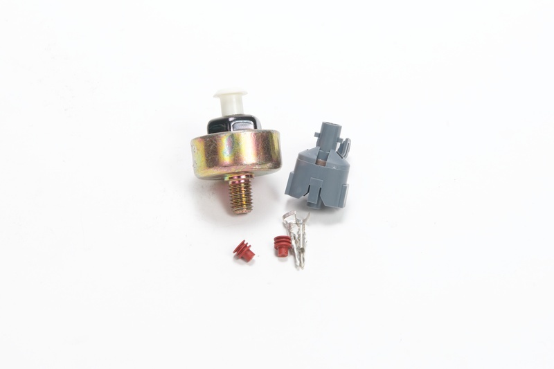 What is a knock sensor on a car engine for?